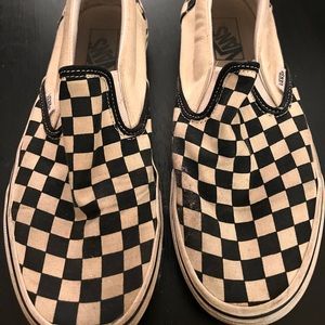 Vans checkered slip ons.